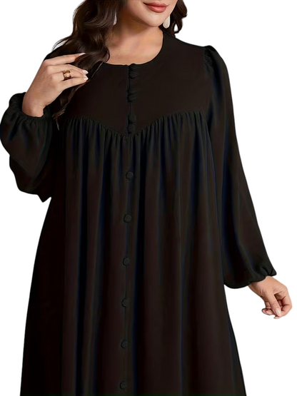 Linen & Loom plus size black long sleeve dress with a round neckline and button-down front in a flowing silhouette.