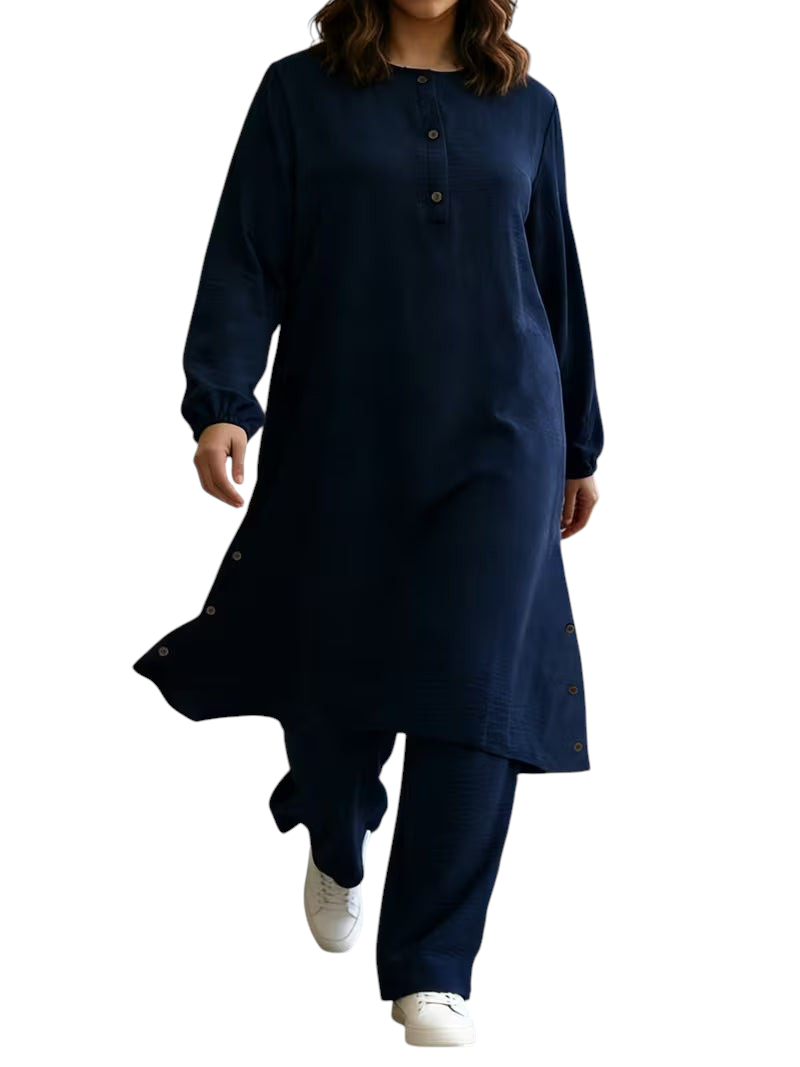 Linen & Loom navy blue long-sleeve abaya tunic with wooden buttons and matching wide-leg pants on a model.