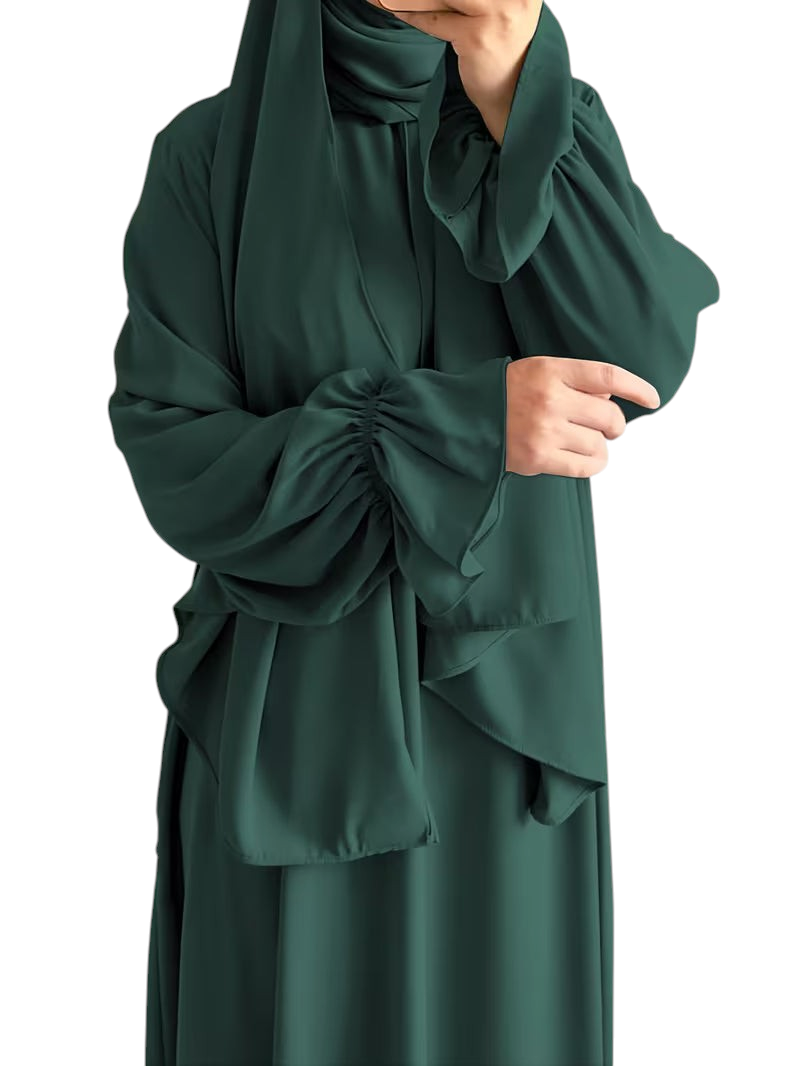 Linen & Loom dark green one-piece abaya with elegant bell sleeves and matching hijab in a flowing modest design