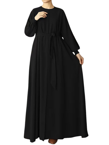 Linen & Loom black solid color abaya with a loose fit, long sleeves, and a waist-tie belt for elegant modest wear.