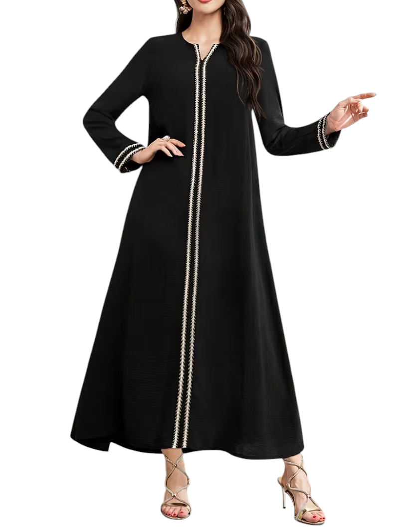 Linen & Loom black Arab-style daily dress with long sleeves and white embroidered trim detail on a model