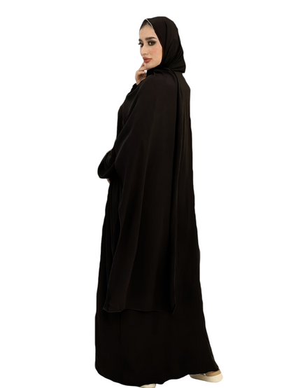 Linen & Loom black traditional abaya with an integrated scarf, featuring a loose, flowing silhouette for modest wear.