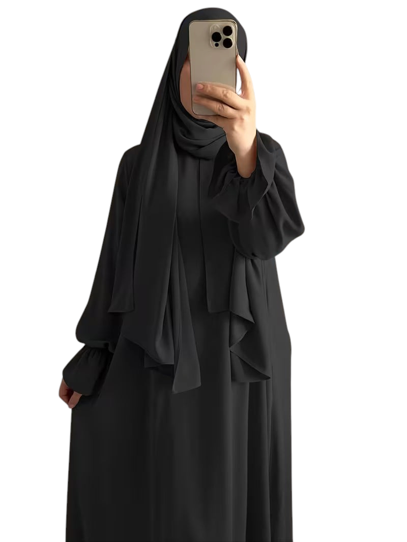 Linen & Loom black one-piece abaya with elegant bell sleeves and a flowing modest silhouette, worn with a matching hijab