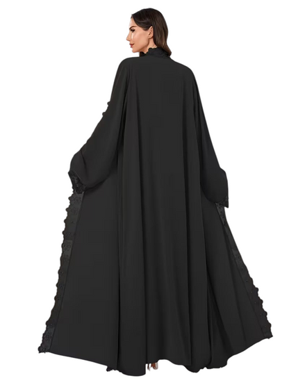 Linen & Loom black 2-piece abaya featuring delicate lace trim and beadwork in a flowing, modest full-length silhouette.