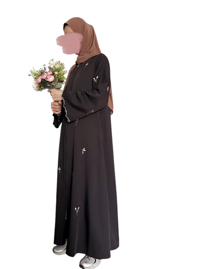 Linen & Loom floral embroidered zip abaya in black and dusty pink, featuring long sleeves and modest full-length fit.