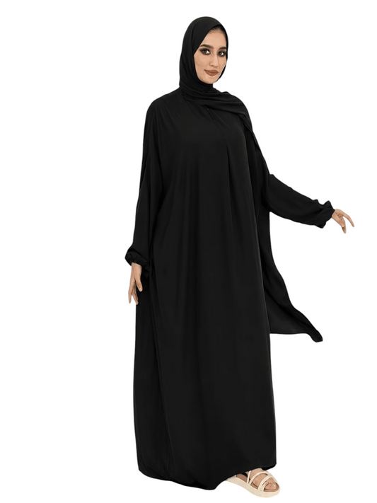 Linen & Loom black traditional abaya with an integrated scarf, featuring a loose flowing fit and elegant design.