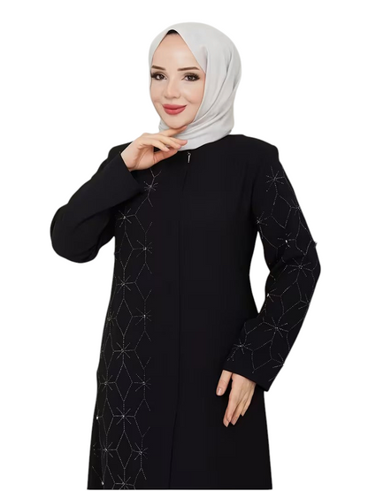Linen & Loom black abaya with geometric rhinestone patterns on sleeves and front, worn with a light grey hijab