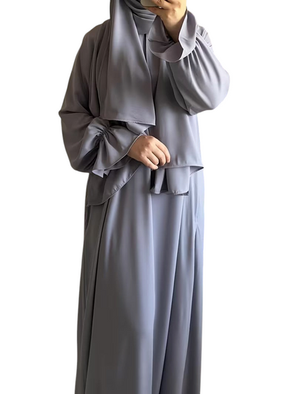 Linen & Loom elegant grey one-piece abaya with bell sleeves and a matching hijab in a modest flowing silhouette.