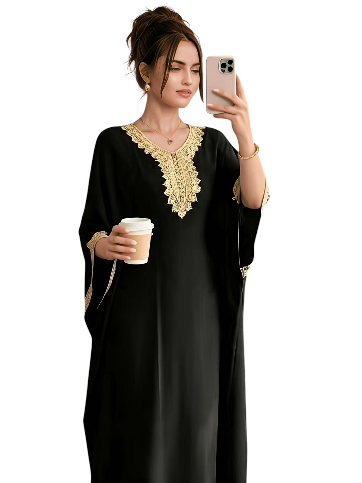 Linen & Loom black batwing abaya featuring intricate golden embroidery on the neckline and cuffs in a cafe setting.