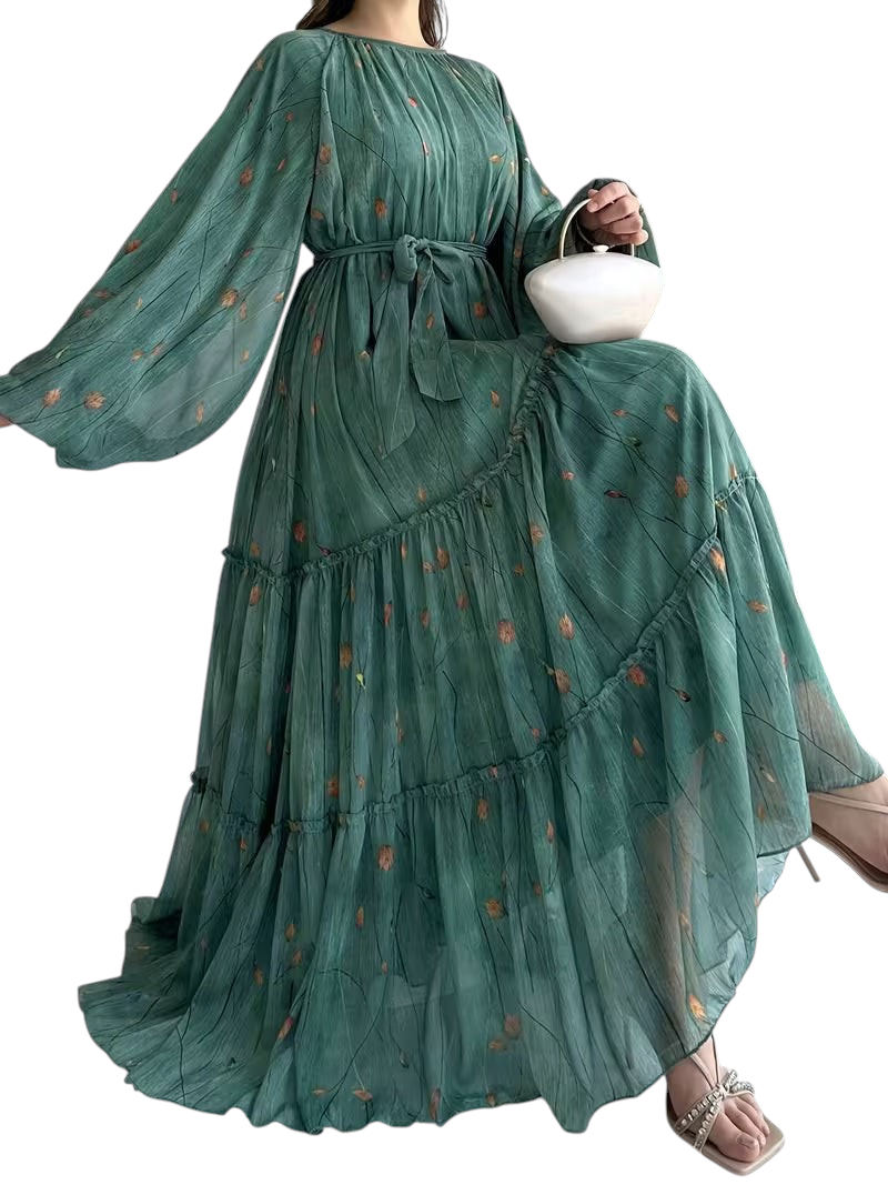 Linen & Loom chiffon abaya dress in sage green with floral print, long sleeves, tiered skirt, and matching waist belt.