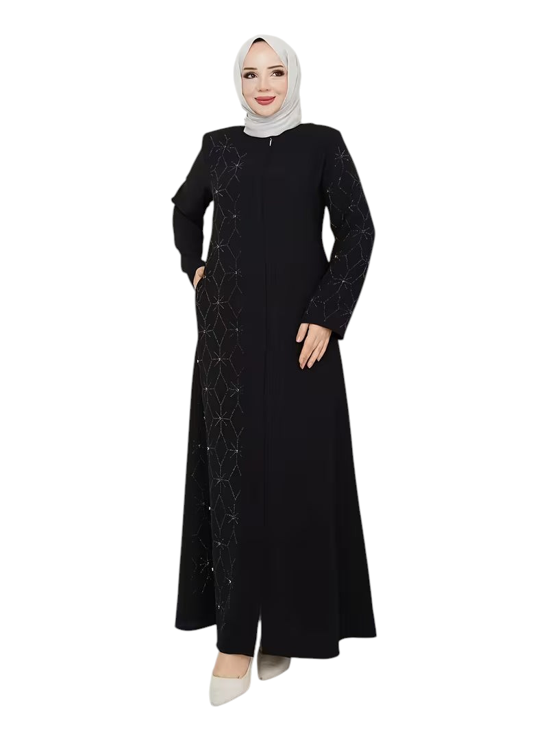 Linen & Loom black abaya with geometric rhinestone detailing, worn by a woman in a light hijab and heels.
