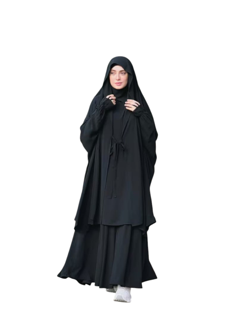 Model wearing a black Linen & Loom 2-piece Arabic style abaya set with lace-up detail and matching headscarf