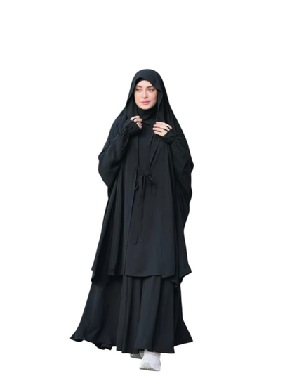 Model wearing a black Linen & Loom 2-piece Arabic style abaya set with lace-up detail and matching headscarf