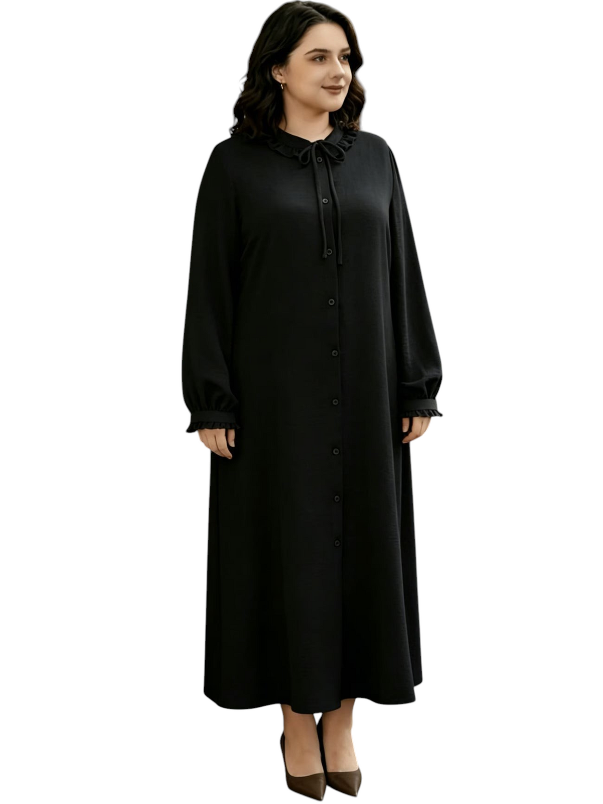 Linen & Loom black ruffle abaya dress with a round neckline, long sleeves, and drawstring waist on a woman outdoors.
