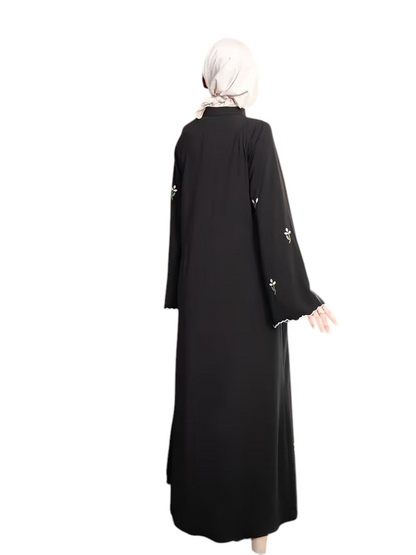 Linen & Loom black full-length abaya with delicate floral embroidery on sleeves and white scalloped trim details
