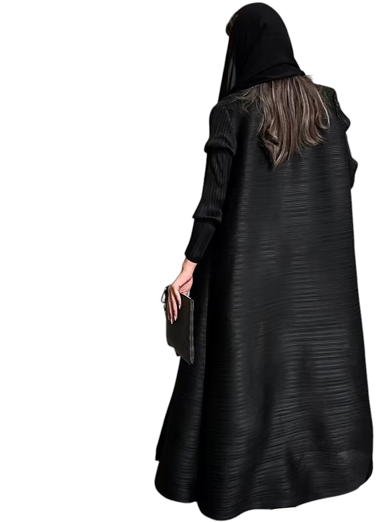 Linen & Loom black plisse abaya with long sleeves and elegant loose fit, worn with a matching headscarf.