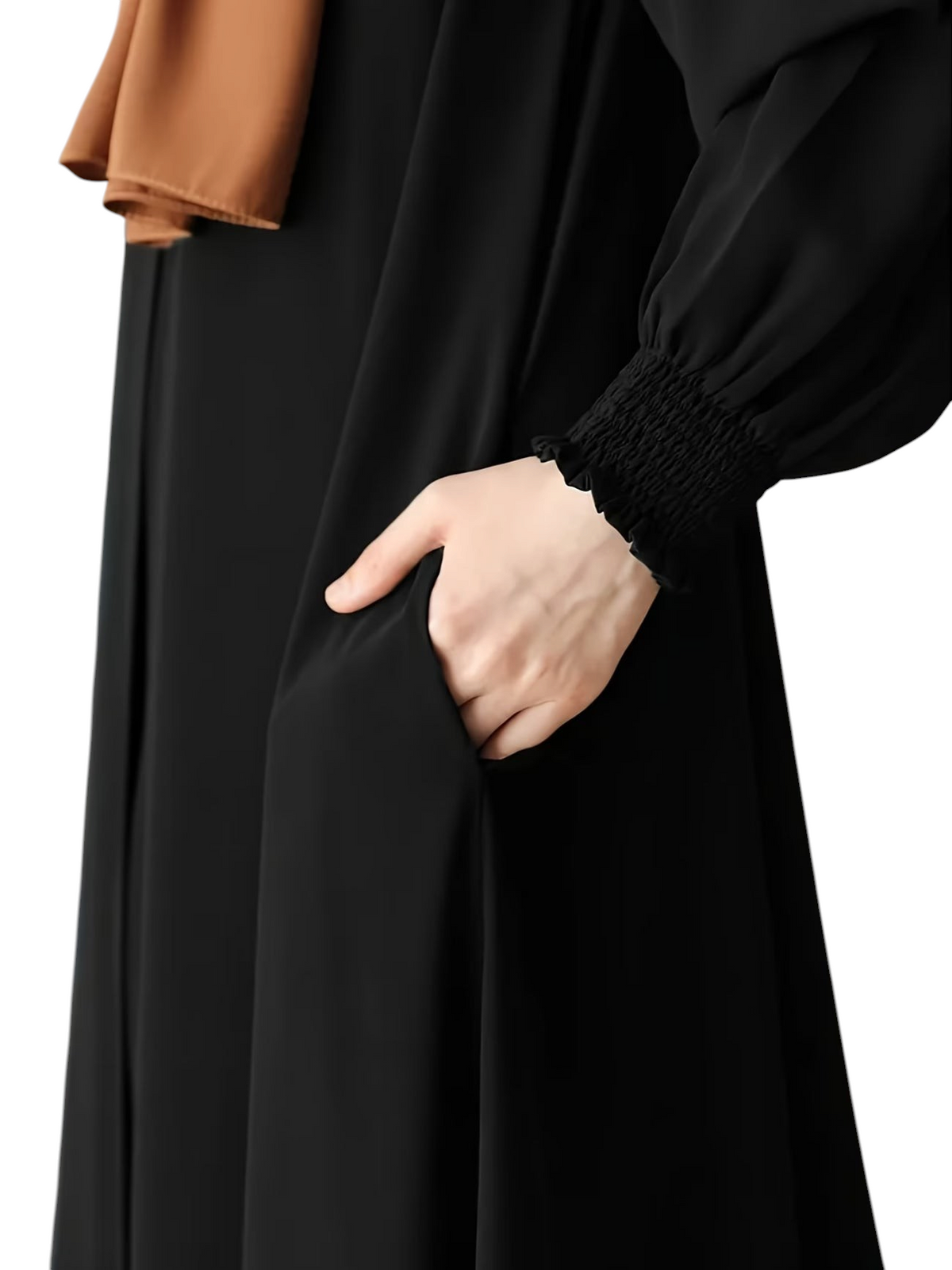 Linen & Loom black abaya featuring a comfortable loose fit, smocked cuffs, and convenient side pockets.