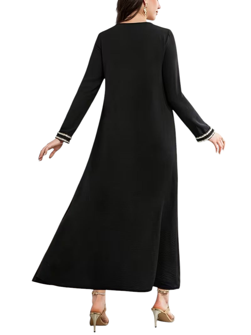Linen & Loom black modest Arab-style daily dress with long sleeves and decorative white cuff detailing, back view