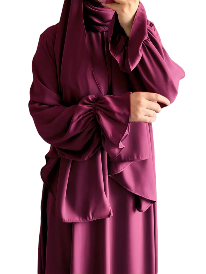 Linen & Loom elegant deep purple one-piece abaya with flowing bell sleeves and matching hijab in a modest style