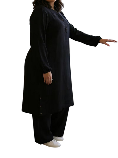 Linen & Loom black long-sleeve abaya tunic with wooden buttons and matching wide-leg pants, worn by a model.