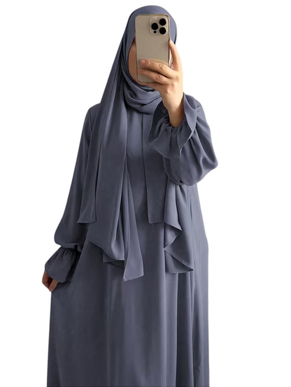 Linen & Loom elegant blue one-piece abaya with bell sleeves and matching hijab, featuring a loose, flowing fit.