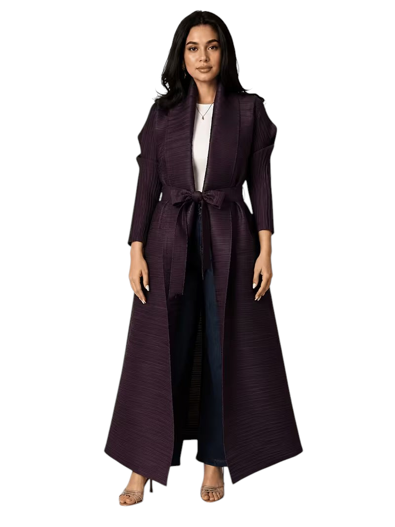 Linen & Loom dark purple pleated cape abaya with a tie-waist, worn over a white top and jeans for a modest look.